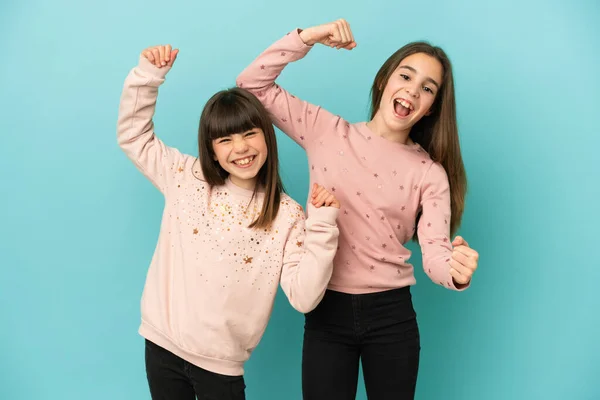 Little Sisters Girls Isolated Blue Background Celebrating Victory — Stock Photo, Image