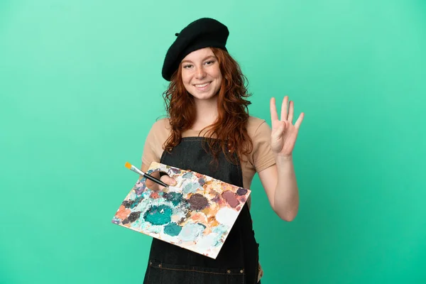 Nastoletni Rudowłosy Artysta Trzymając Paletę Odizolowany Zielonym Tle Szczęśliwy Licząc — Zdjęcie stockowe