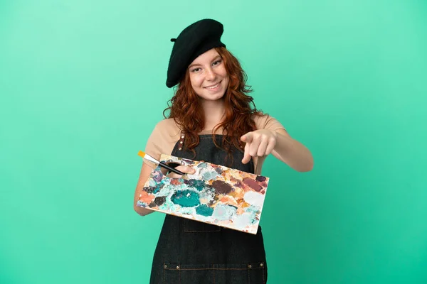 Teenager Redhead Artist Holding Palette Isolated Green Background Pointing Front — Stock Photo, Image