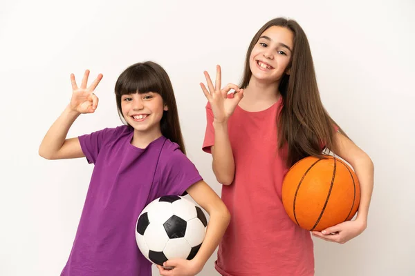 Irmãzinhas Jogando Futebol Basquete Isolado Fundo Branco Mostrando Sinal Com — Fotografia de Stock