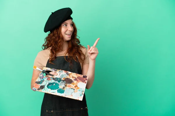 Teenager Redhead Artist Holding Palette Isolated Green Background Intending Realizes — Stock Photo, Image