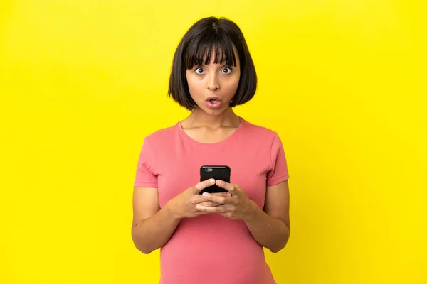 Young Mixed Race Pregnant Woman Isolated Yellow Background Looking Camera — Stock Photo, Image