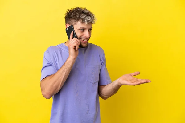 Young Caucasian Man Using Mobile Phone Isolated Yellow Background Surprise — Stock Photo, Image