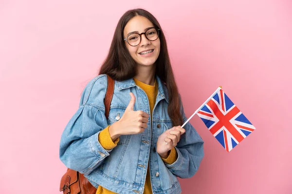 국기를 프랑스 소녀가 분홍색 배경에 고립되어 엄지손가락을 치켜들고 몸짓을 — 스톡 사진