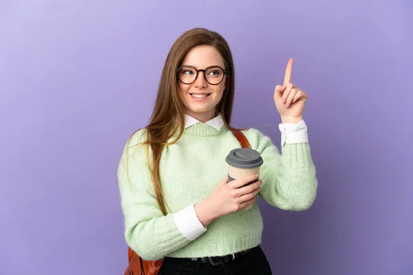 Adolescente Estudiante Chica Sobre Aislado Púrpura Fondo Apuntando Una Gran —  Fotos de Stock