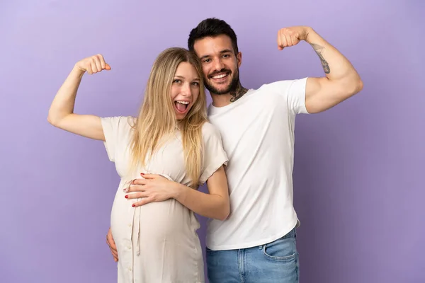 Young Couple Pregnant Doing Strong Gesture — Stock Photo, Image