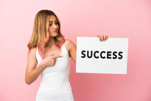 Young Woman Isolated Pink Background Holding Placard Text Success Pointing — Stock Photo, Image