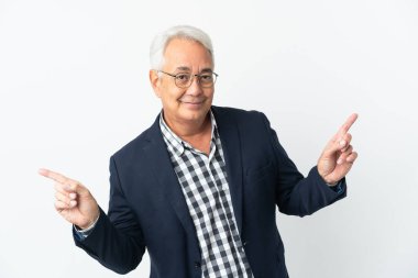 Middle age Brazilian man isolated on white background pointing finger to the laterals and happy