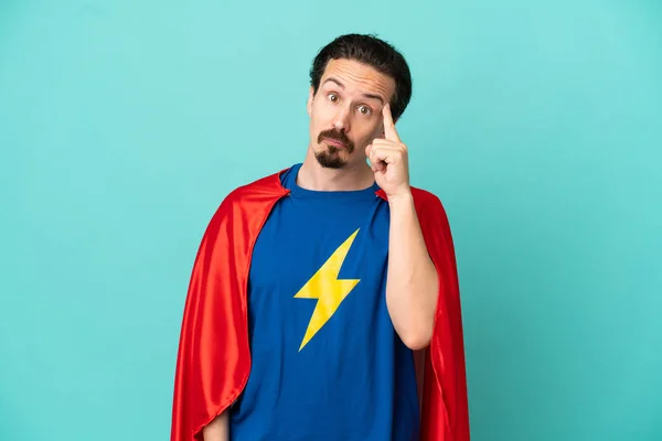 Super Hero Caucasian Man Isolated Blue Background Thinking Idea — Φωτογραφία Αρχείου