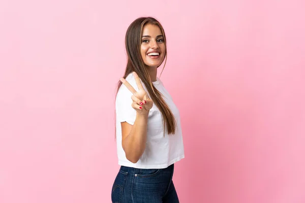Young Uruguayan Woman Isolated Pink Background Smiling Showing Victory Sign —  Fotos de Stock