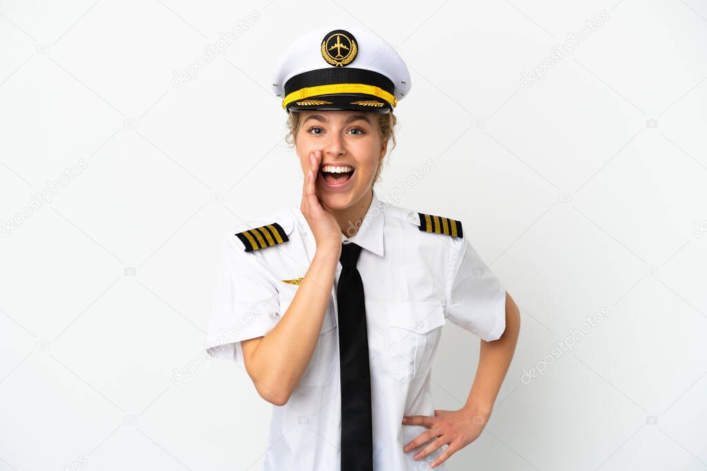 Airplane blonde woman pilot isolated on white background shouting with mouth wide open