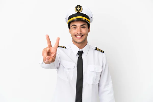 Pilot Samolotu Nad Odizolowanym Białym Tle Uśmiechając Się Pokazując Znak — Zdjęcie stockowe