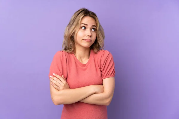 Teenager Russian Girl Isolated Purple Background Making Doubts Gesture While — ストック写真