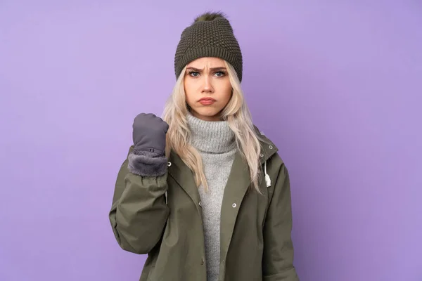 Teenager Blonde Girl Winter Hat Isolated Purple Background Angry Gesture — Stock Photo, Image