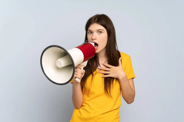 Young Ukrainian Girl Isolated White Background Shouting Megaphone Surprised Expression — ストック写真