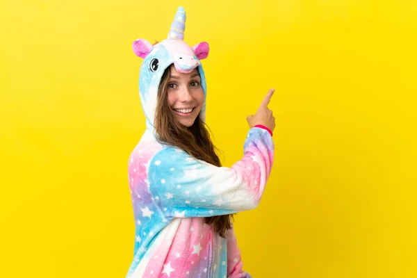 Girl Unicorn Pajamas Isolated Background Pointing Back — Stock Photo, Image