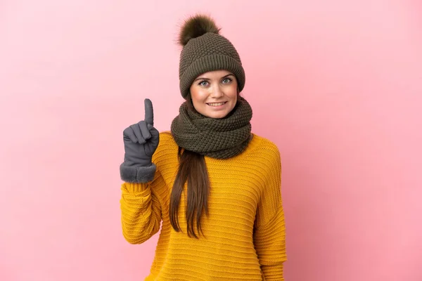 Young Caucasian Girl Winter Hat Isolated Pink Background Showing Lifting — Stock Photo, Image