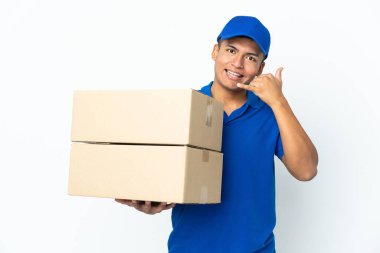Delivery Ecuadorian man isolated on white background making phone gesture. Call me back sign