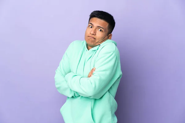 Young Ecuadorian Man Isolated Purple Background Making Doubts Gesture While — Stock Fotó