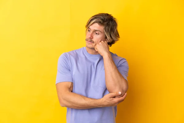Handsome Blonde Man Isolated Yellow Background Tired Bored Expression — Stock fotografie