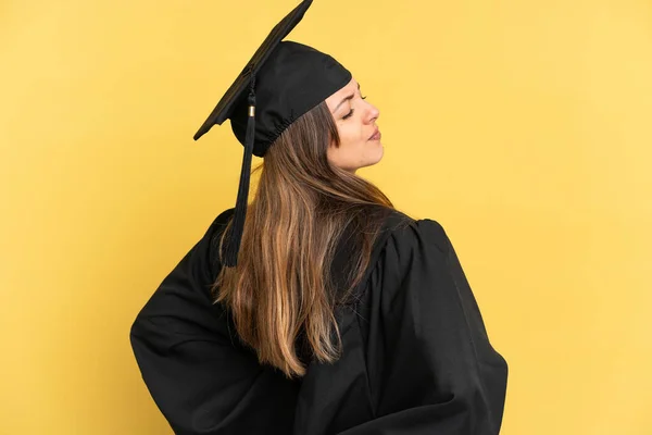 Young University Graduate Isolated Yellow Background Suffering Backache Having Made — Foto de Stock