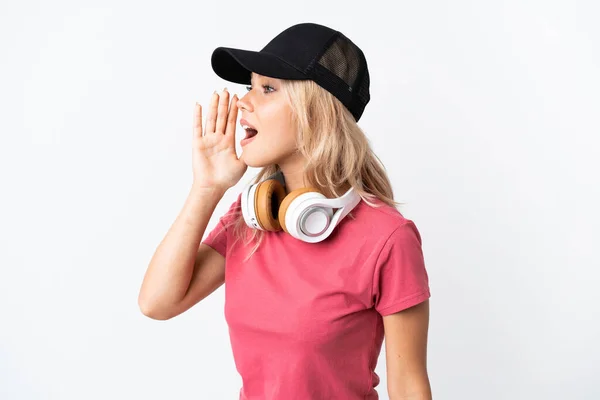 Young Russian Woman Listening Music Isolated White Background Shouting Mouth — ストック写真
