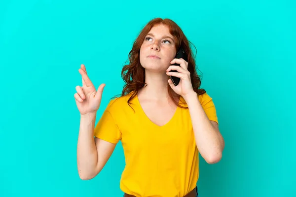 Teenager Reddish Woman Using Mobile Phone Isolated Blue Background Fingers — Photo