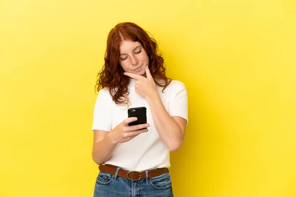 Teenager Reddish Woman Isolated Yellow Background Thinking Sending Message —  Fotos de Stock