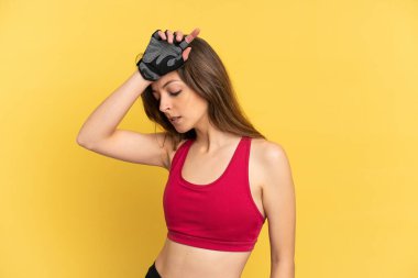 Young caucasian woman isolated on blue background with tired expression