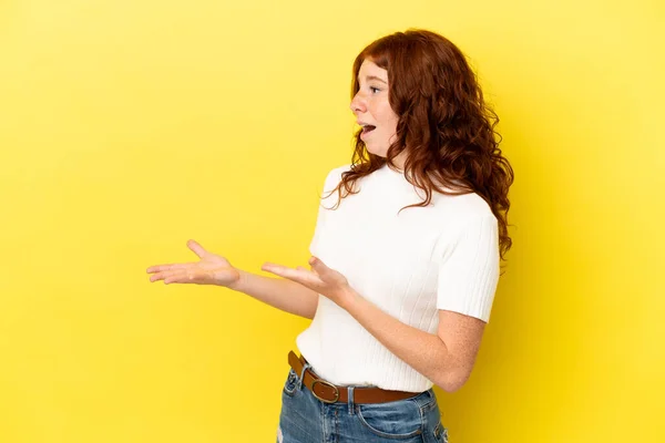 Teenager Reddish Woman Isolated Yellow Background Surprise Expression While Looking — Foto de Stock
