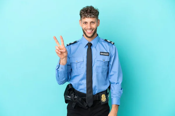 Joven Policía Hombre Rubio Aislado Blanco Sobre Fondo Azul Sonriendo —  Fotos de Stock