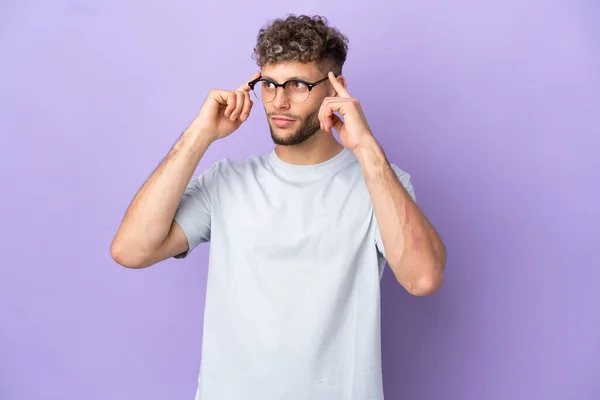 Delivery Caucasian Man Isolated Purple Background Having Doubts Thinking — Stock Photo, Image
