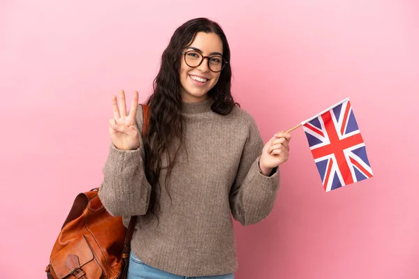 Mladá Běloška Drží Vlajku Spojeného Království Izolované Růžovém Pozadí Šťastný — Stock fotografie
