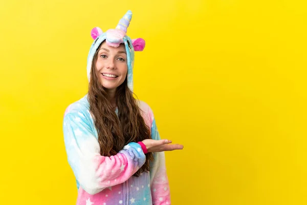 Girl Unicorn Pajamas Isolated Background Presenting Idea While Looking Smiling — Stock Photo, Image