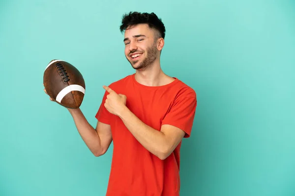 Young Caucasian Man Playing Rugby Isolated Blue Background Pointing Back — Stock Photo, Image