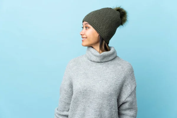 Young Uruguayan Girl Winter Hat Isolated Blue Background Looking Side — Stock Photo, Image