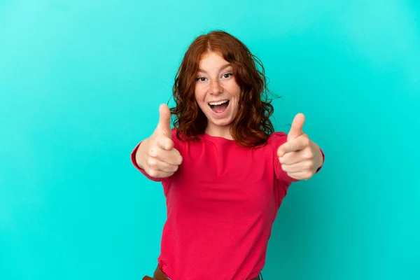 Teenager Reddish Woman Isolated Blue Background Surprised Pointing Front — Stock Photo, Image