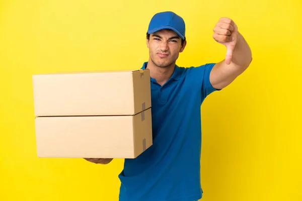 Delivery Man Isolated Yellow Wall Showing Thumb Negative Expression — Stock Photo, Image