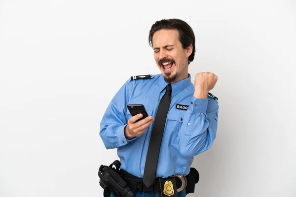 Jonge Politieman Geïsoleerde Achtergrond Wit Met Telefoon Overwinningspositie — Stockfoto