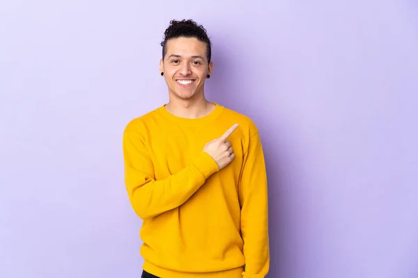 stock image Caucasian man over isolated background pointing to the side to present a product