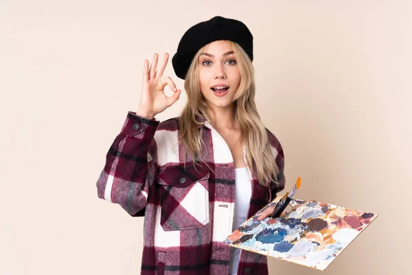 Adolescente Artista Chica Sosteniendo Una Paleta Aislada Sobre Fondo Azul — Foto de Stock