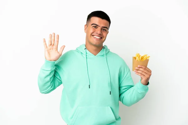 Jonge Knappe Man Met Gebakken Chips Geïsoleerde Witte Achtergrond Salueren — Stockfoto