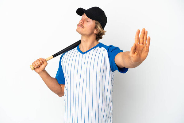 Young blonde man playing baseball isolated on white background making stop gesture and disappointed