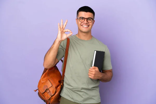 Guapo Estudiante Hombre Sobre Aislado Fondo Mostrando Signo Con Los — Foto de Stock