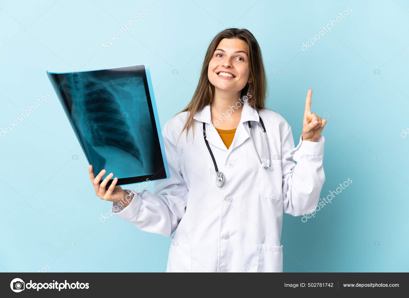 Young Doctor Woman Holding Radiography Isolated Background Pointing