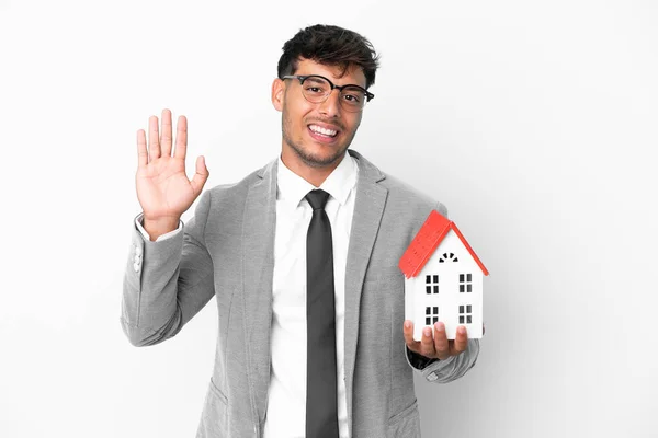 Business Man Holding House Isolated Blue Background Saluting Hand Happy — Stock Photo, Image
