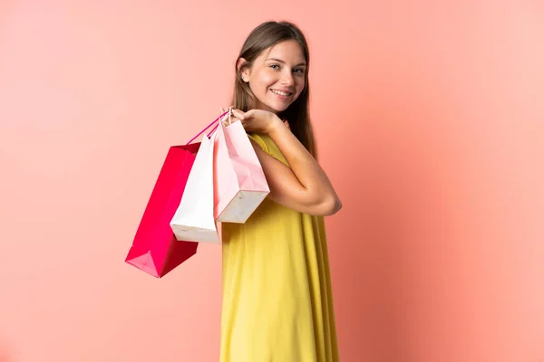 Jonge Litouwse Vrouw Geïsoleerd Roze Achtergrond Houden Boodschappentassen Glimlachen — Stockfoto