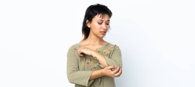 Genç Uruguaylı kız izole edilmiş beyaz arka plan üzerinde dirsek ağrısı ile