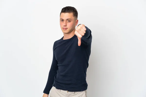 Young Caucasian Man Isolated White Background Showing Thumb Negative Expression — Stock Photo, Image