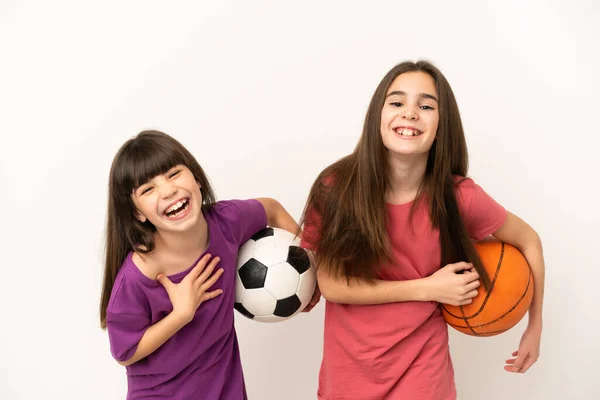 Irmãzinhas Jogando Futebol Basquete Isolado Fundo Branco Sorrindo Muito Colocar — Fotografia de Stock